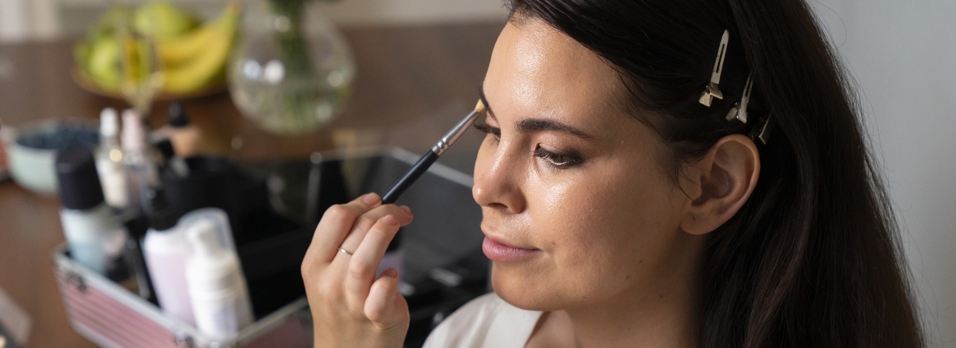 Woman putting on makeup